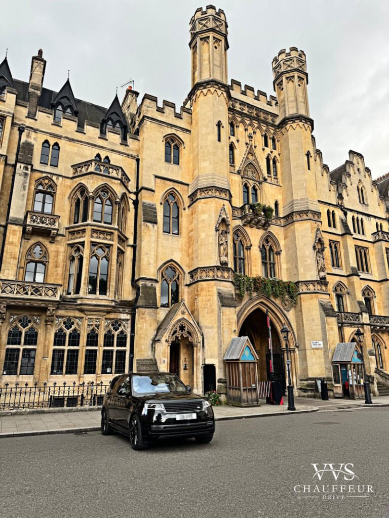 Luxury black Range Rover parked outside Westminster Abbey in London, highlighting the iconic Gothic architecture and premium chauffeur services near historic landmarks.